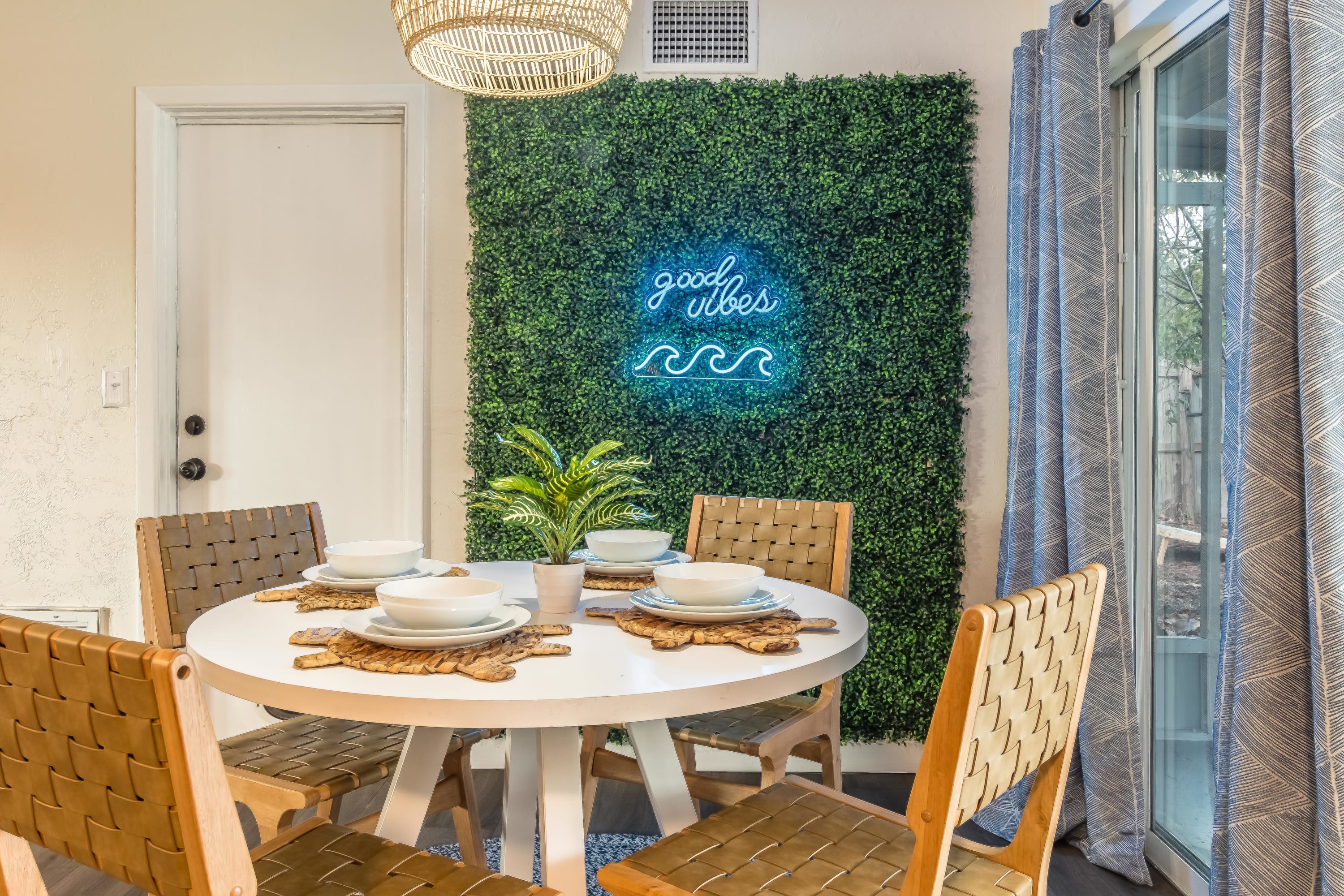 Cozy dining nook w/ natural light and views into lush surroundings.
