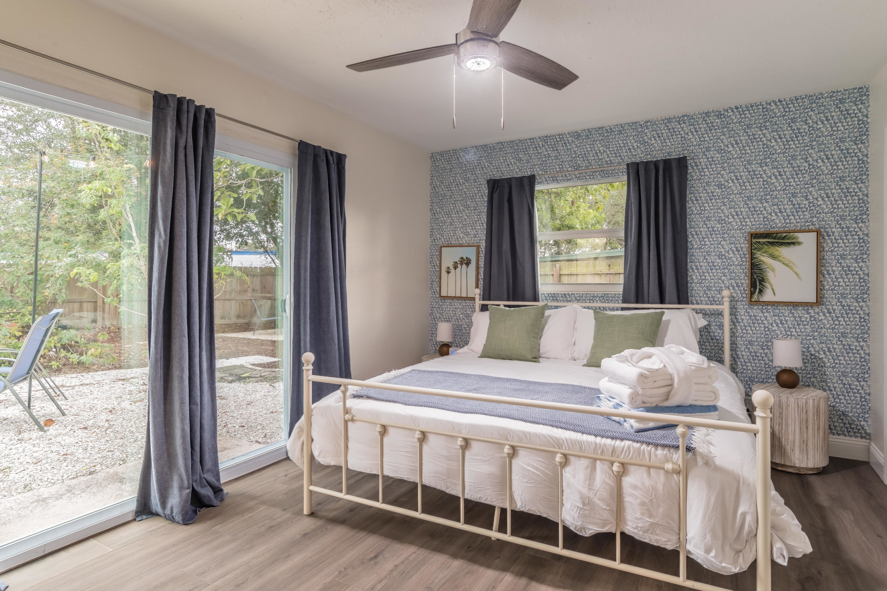 Comfortable bedroom w/ layered bedding and soft lighting for restful nights.
