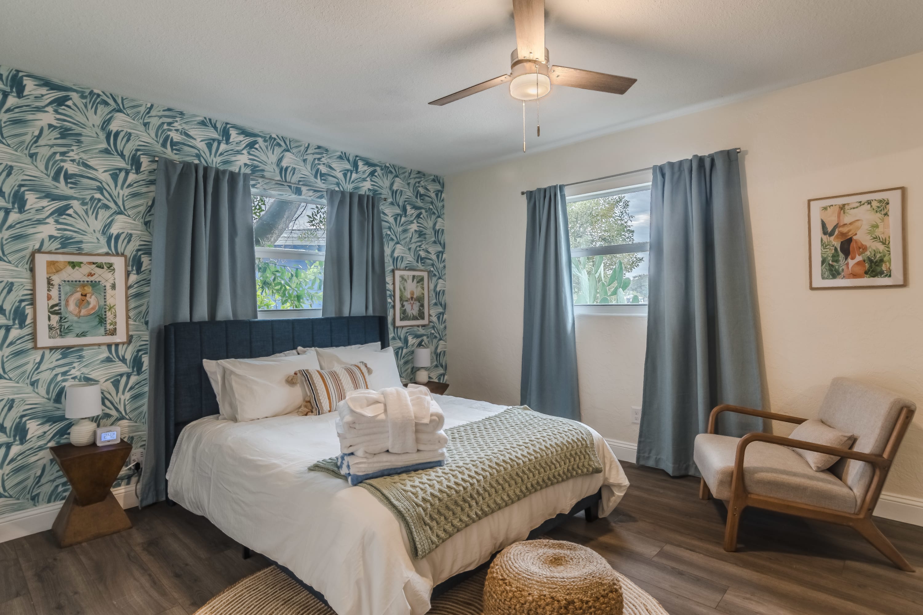 Calm bedroom w/ soft tones and layered bedding for restful nights.