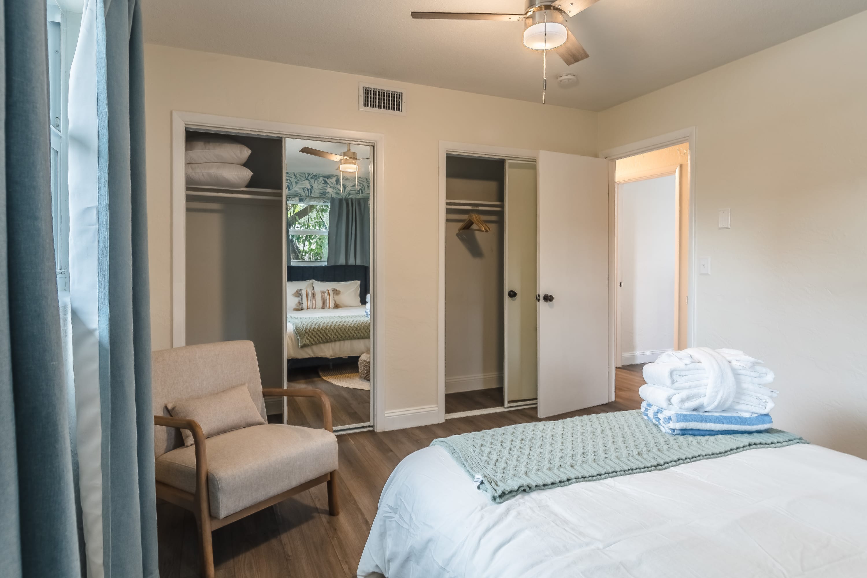 Bedroom featuring patterned walls and a peaceful, tucked-away feel.