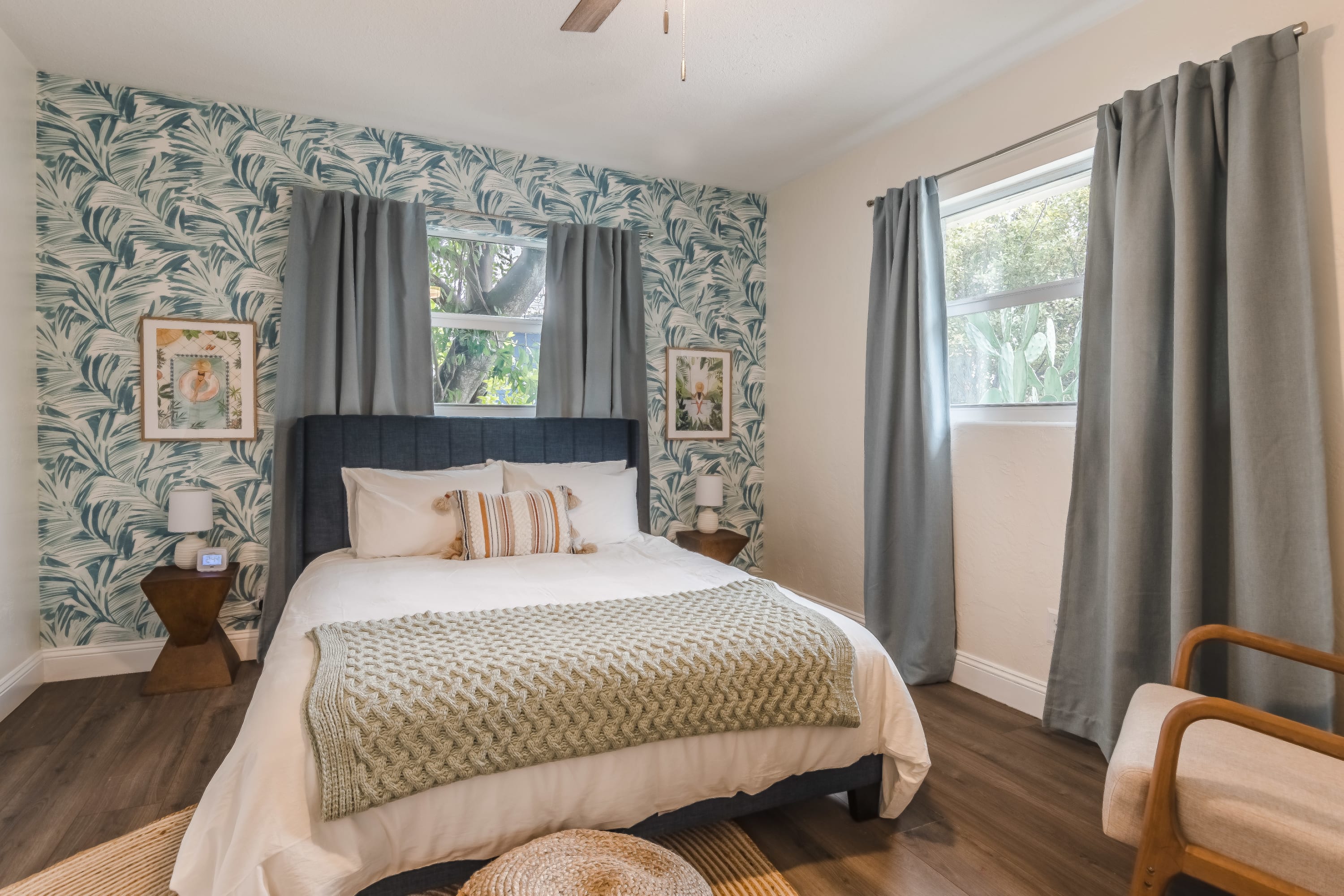 Cozy bedroom w/ warm wood accents and soothing decor.