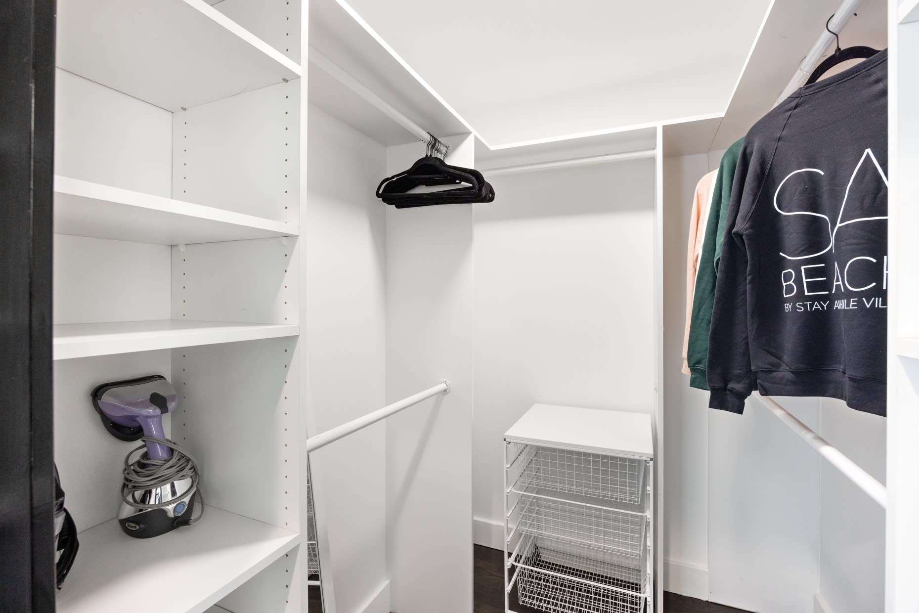 Discover convenience and elegance in our spacious walk-in closet, perfect for organizing your wardrobe and personal items.
