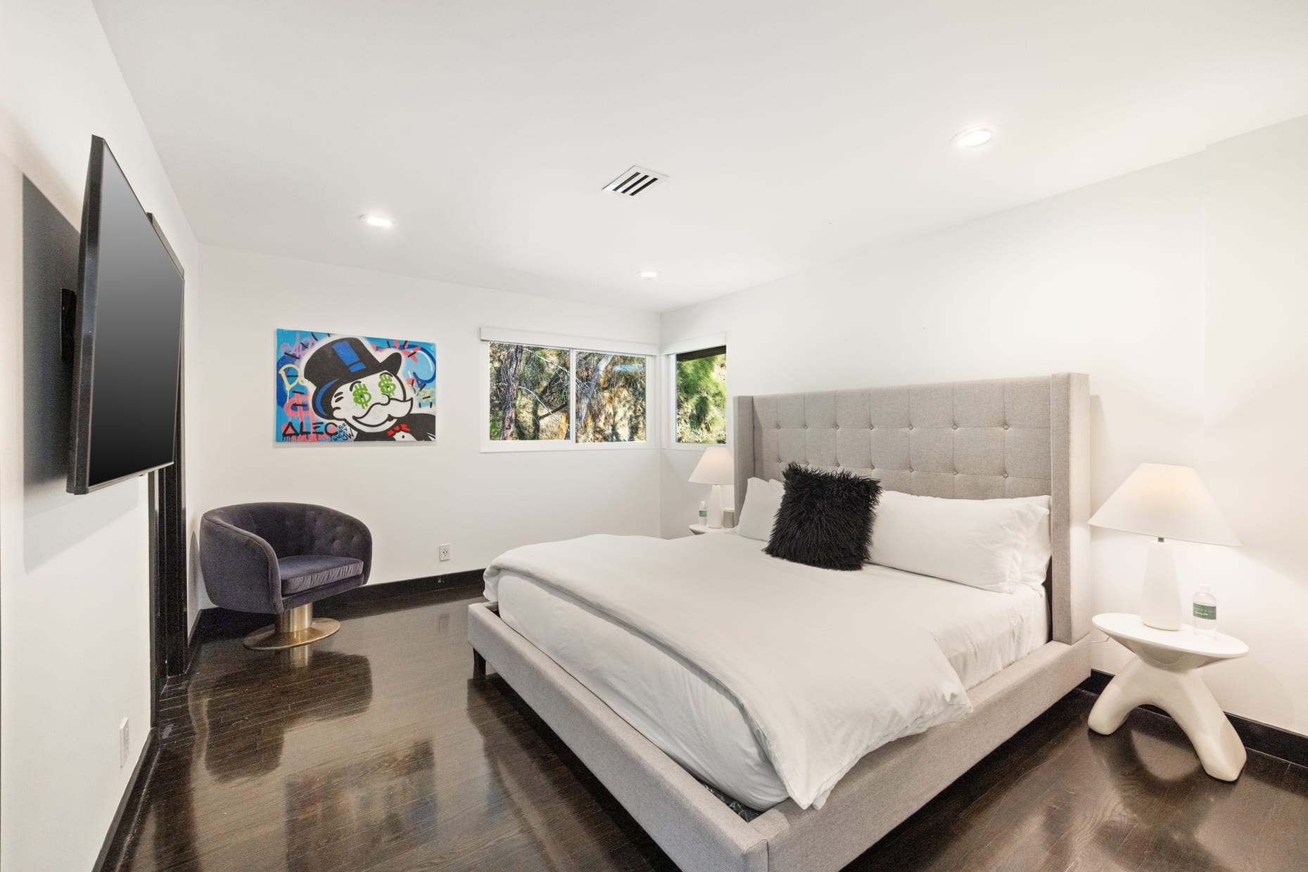 Discover relaxation in our serene bedroom retreat, complete with a plush king-size bed and blackout shades.