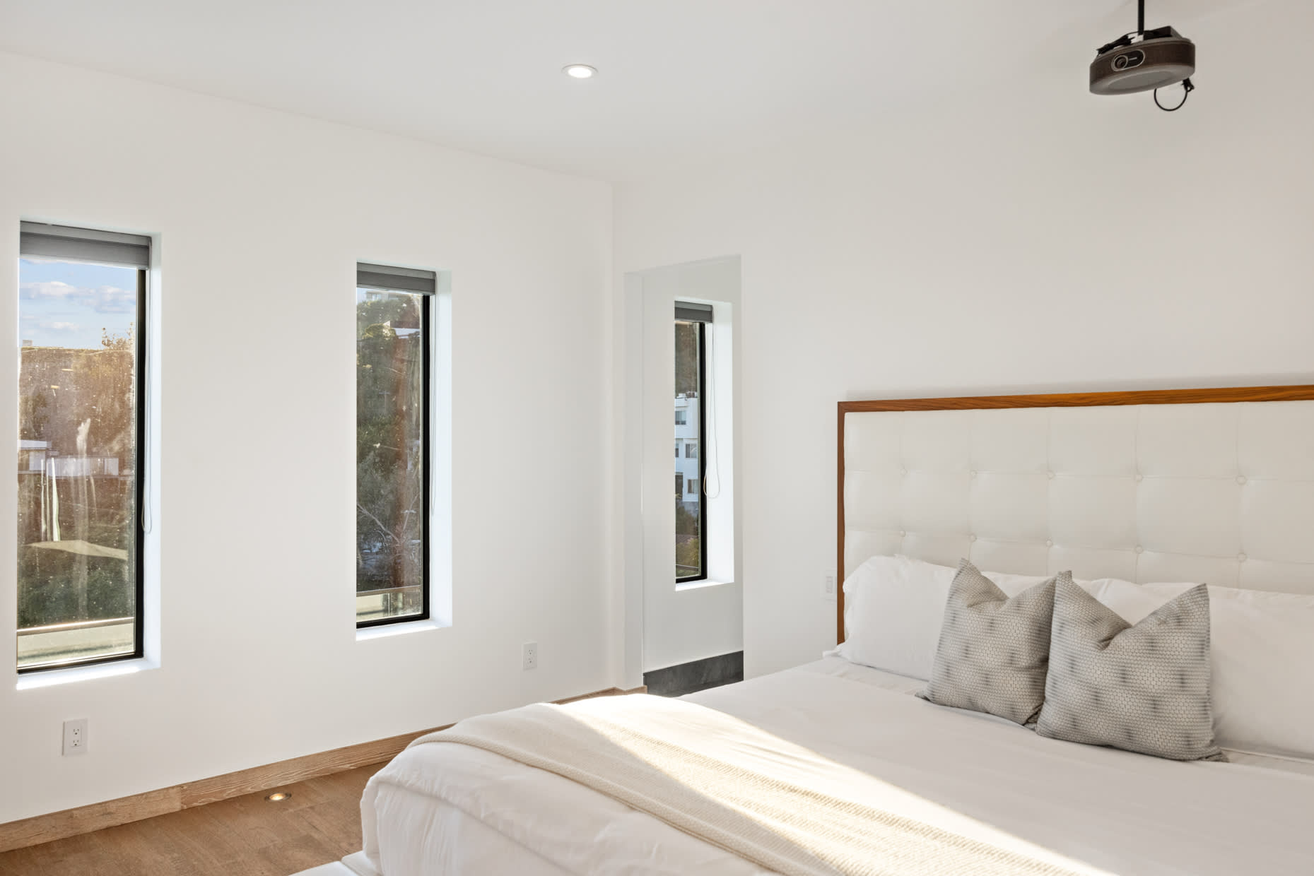 Our luxurious Guest Bedroom #3 is a haven of tranquility, featuring a king-size bed, Smart TV, and ensuite bath.