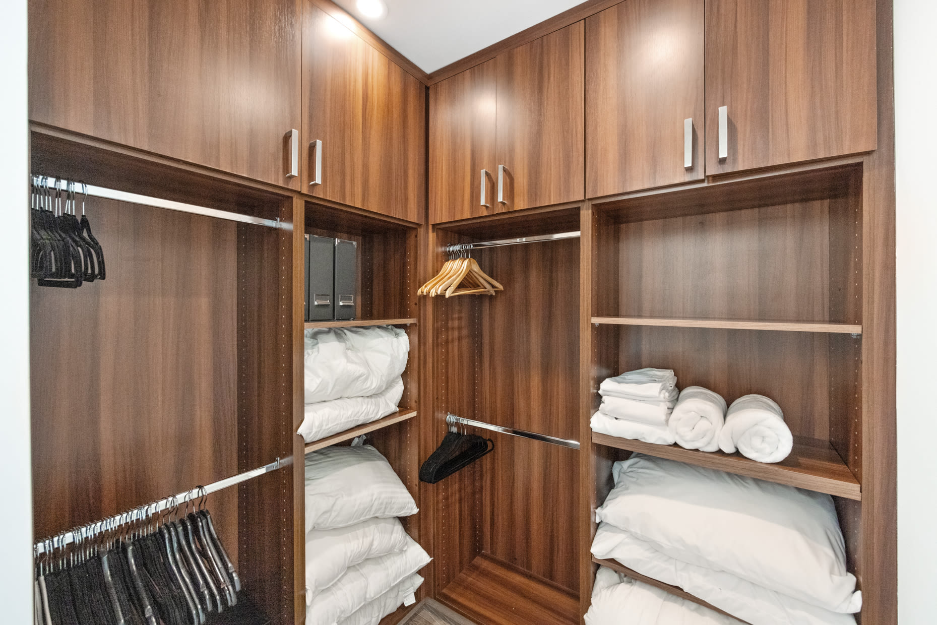 Organize your wardrobe in style in our expansive walk-in closet, offering ample space and luxurious detailing.