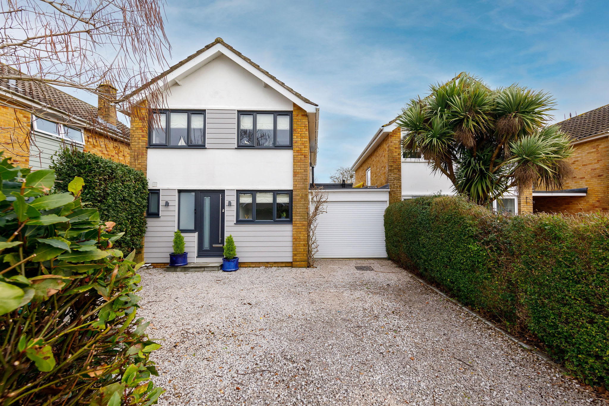 The exterior of the property with parking for 3 cars.