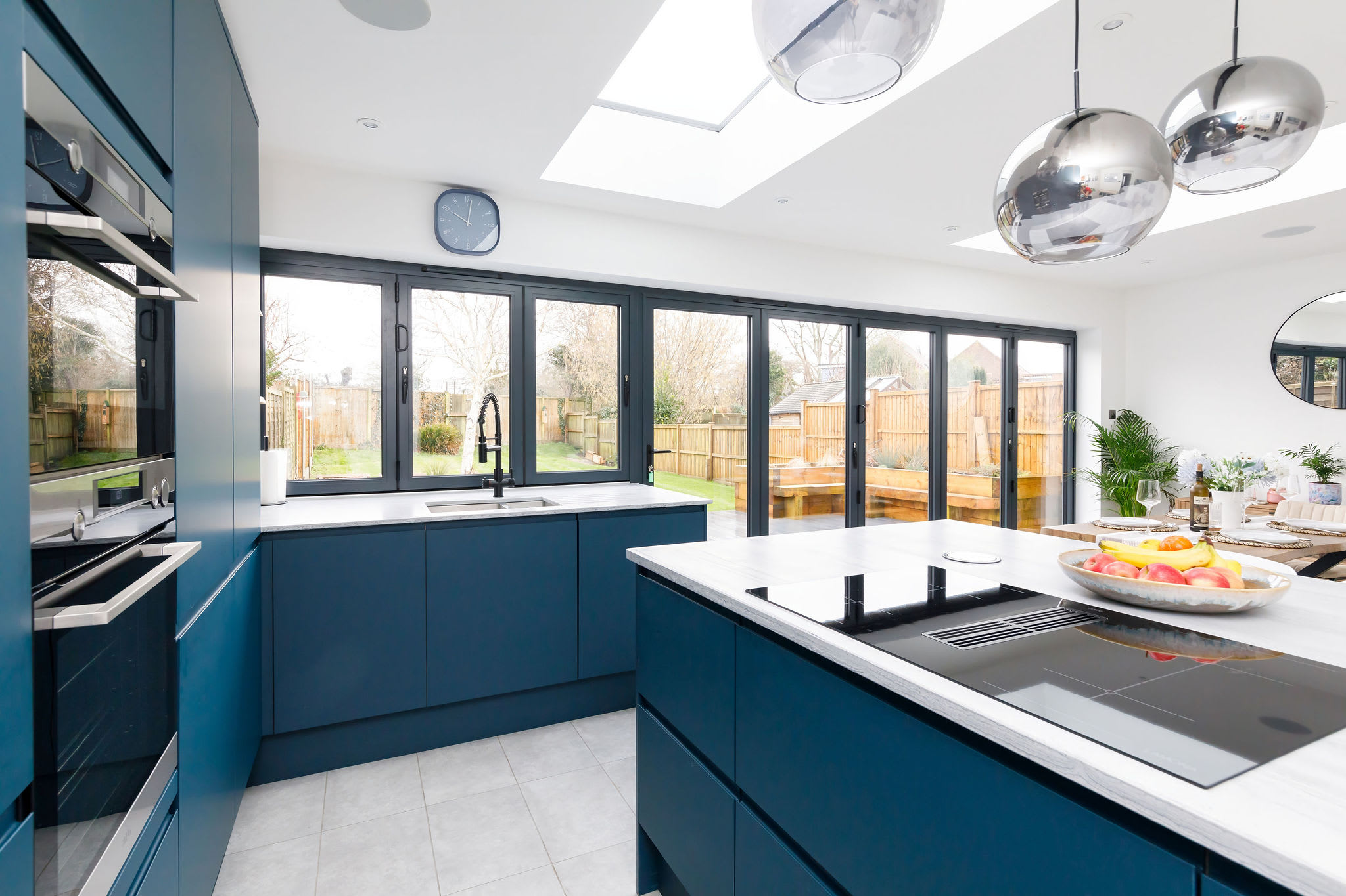 The modern kitchen is fully equipped with state-of-the-art appliances, spacious countertops and ample cabinetry for preparing and cooking.