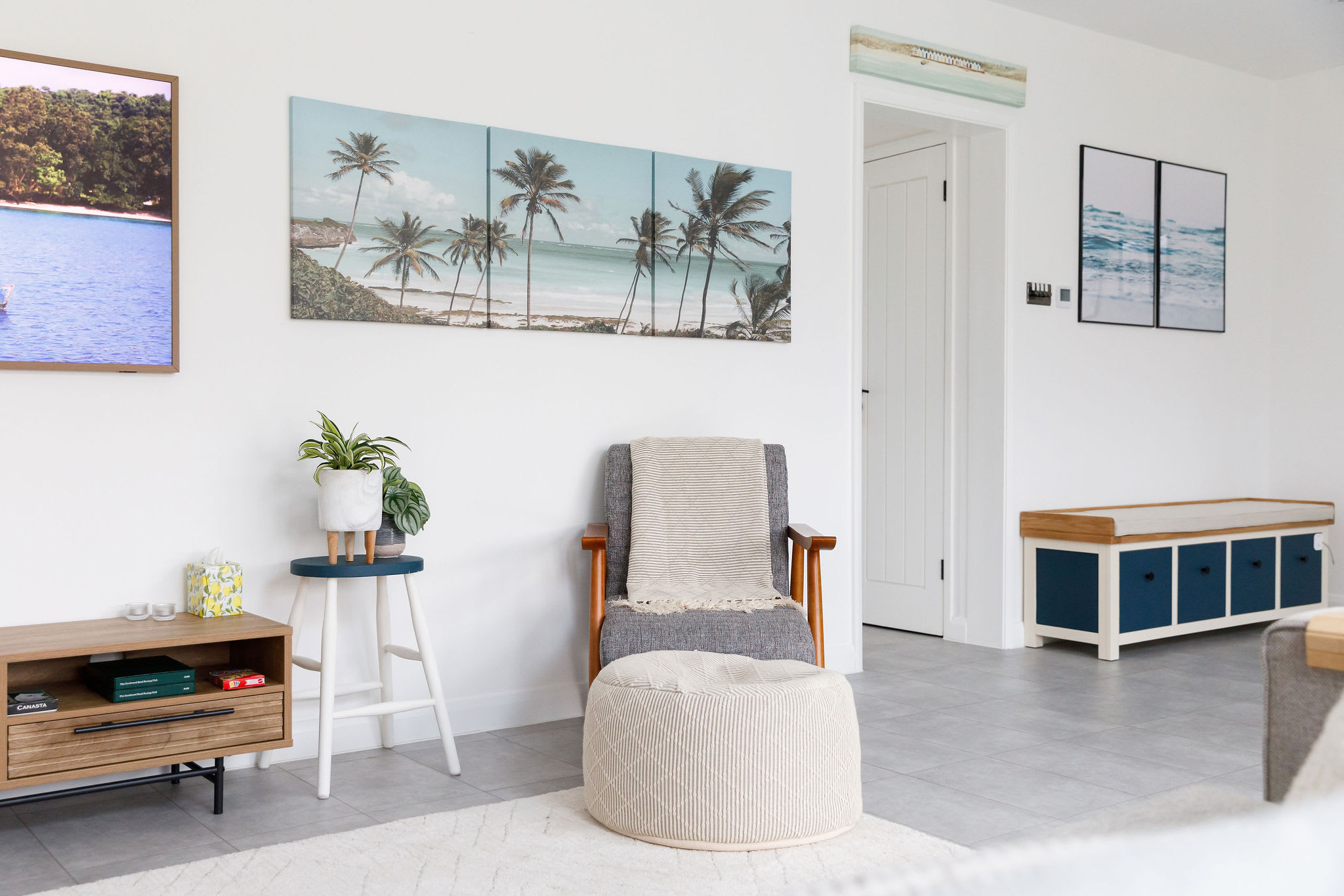 Modern art and coastal tones give the home a fresh and inviting feel, with comfortable furniture for ultimate relaxation.