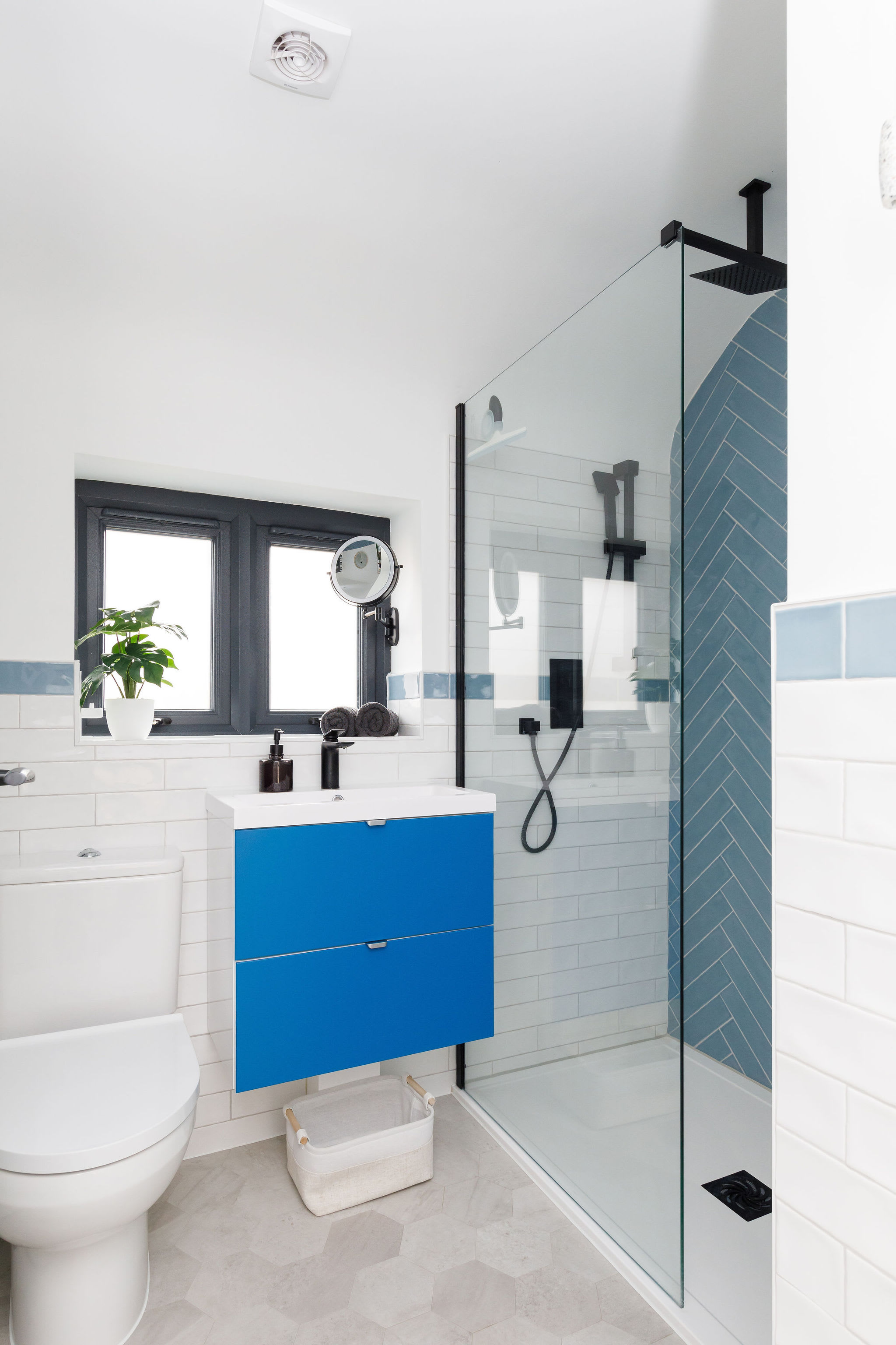 Enjoy the luxury of a large walk-in shower in the family bathroom.