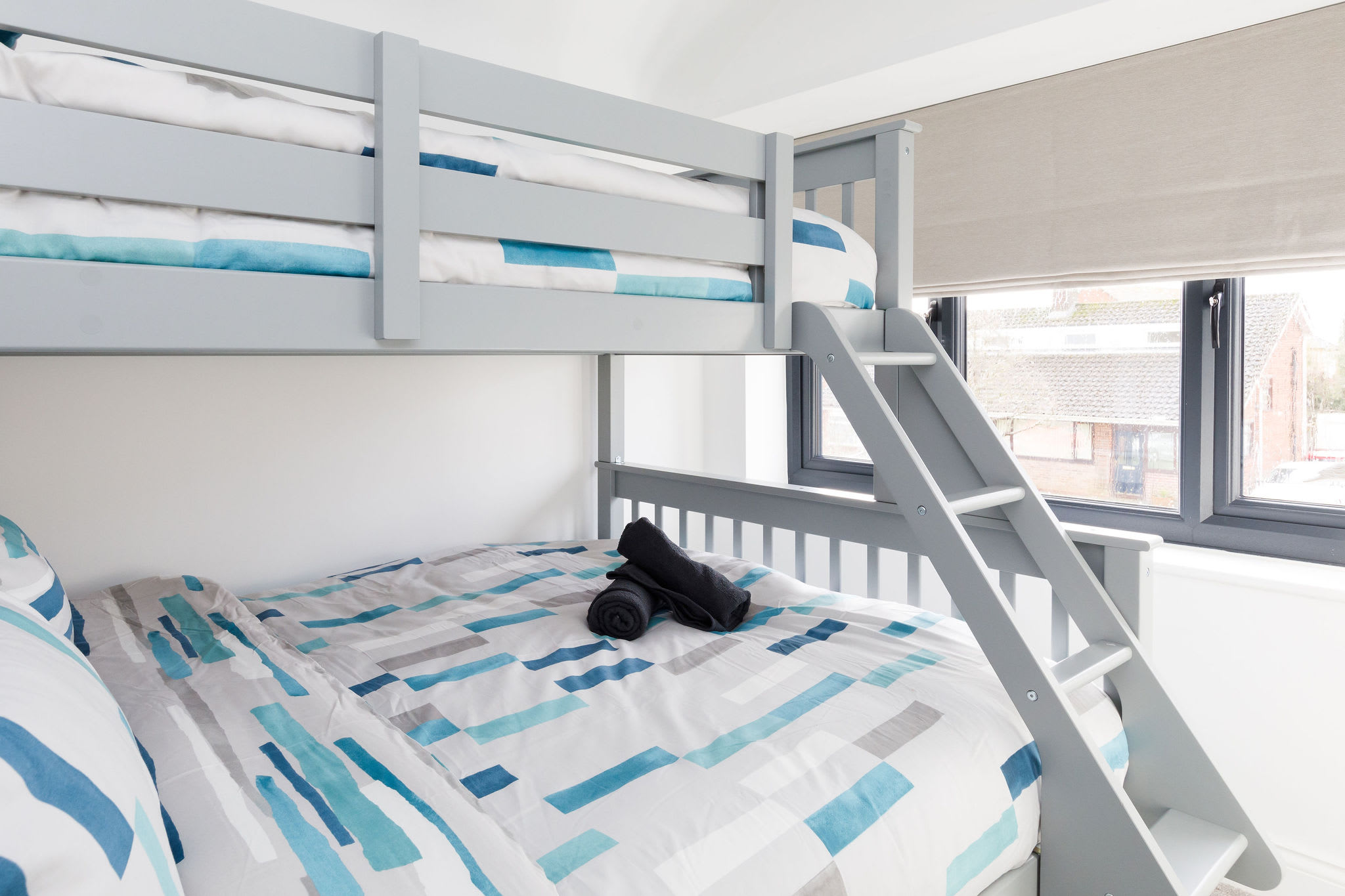 A single bunk is at the top (recommended for children), with a double on the bottom.