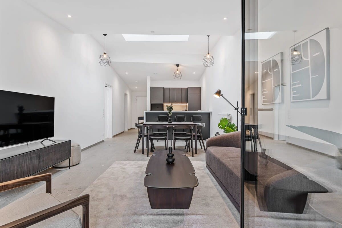 Chic and comfortable living space with the added luxury of a scenic balcony view.