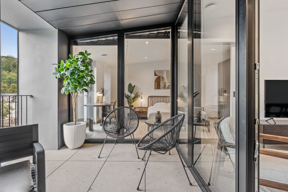 Relaxation awaits on your personal balcony overlooking serene landscapes.