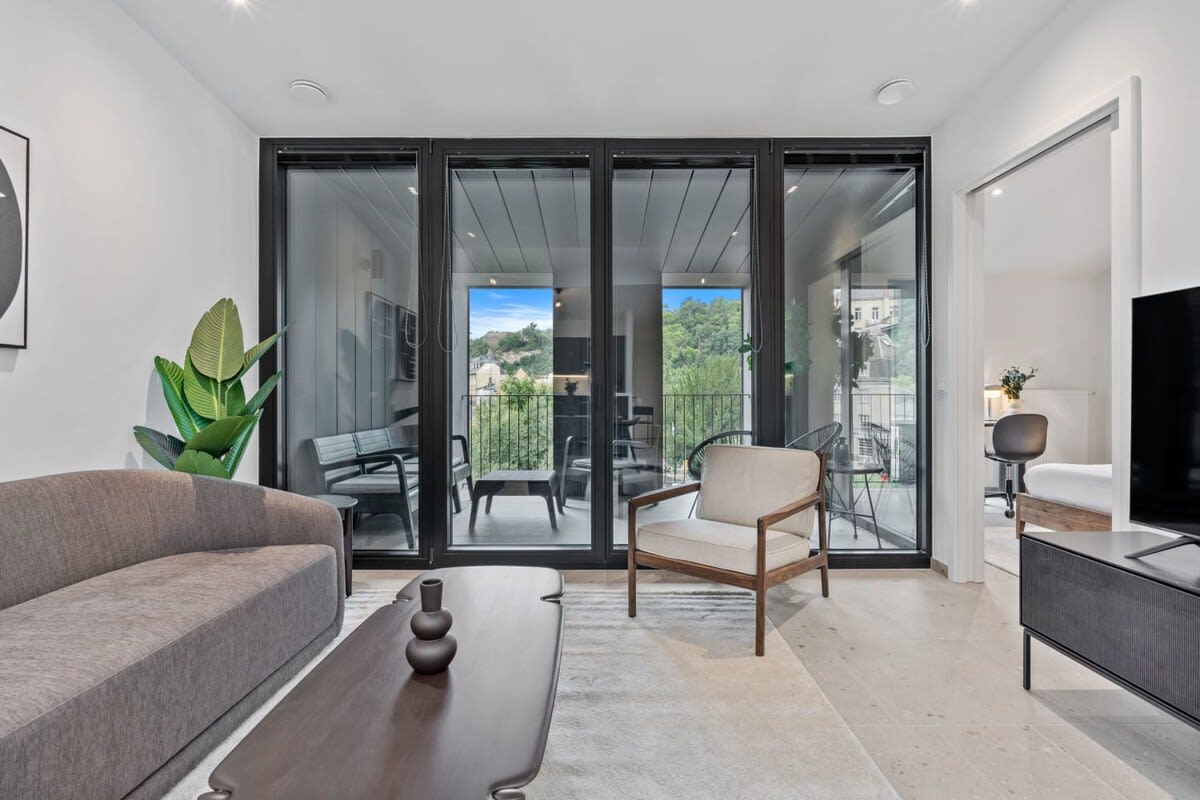 Slide open the doors to a balcony that brings the calmness of nature to your living room.