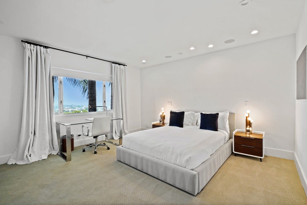 Utilize the convenient desk space in the bedroom for work or study, combining productivity with relaxation.