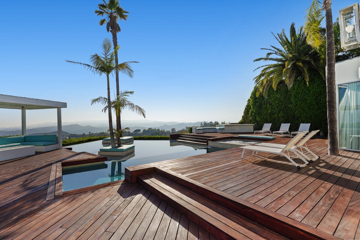 Savor sweeping views of the surrounding landscape from the outdoor deck, providing a breathtaking backdrop for relaxation.