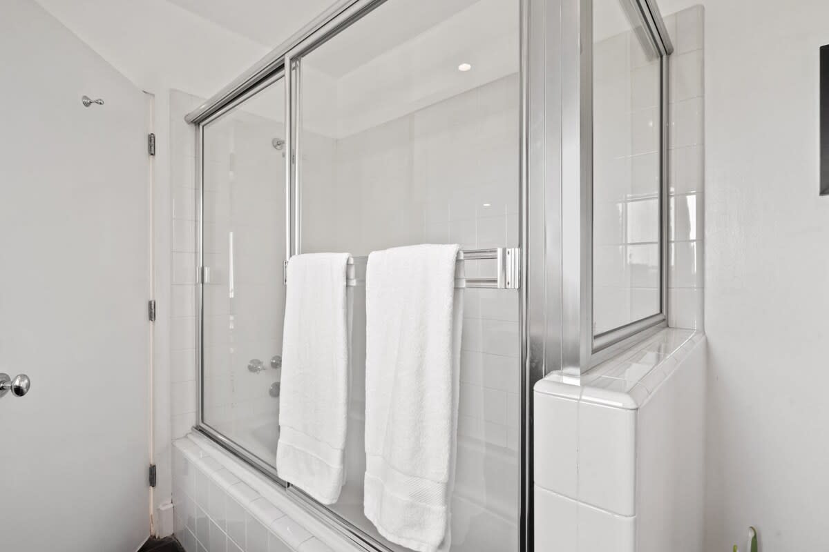 The ensuite bathroom offers both a shower and tub in one, providing options for your bathing preferences.