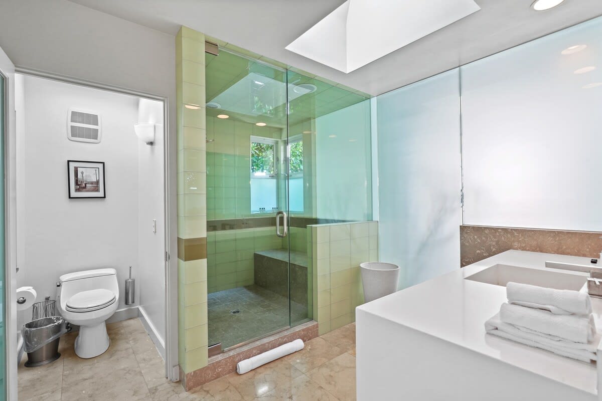 Rejuvenate in the spacious steam shower, offering a luxurious and indulgent experience.