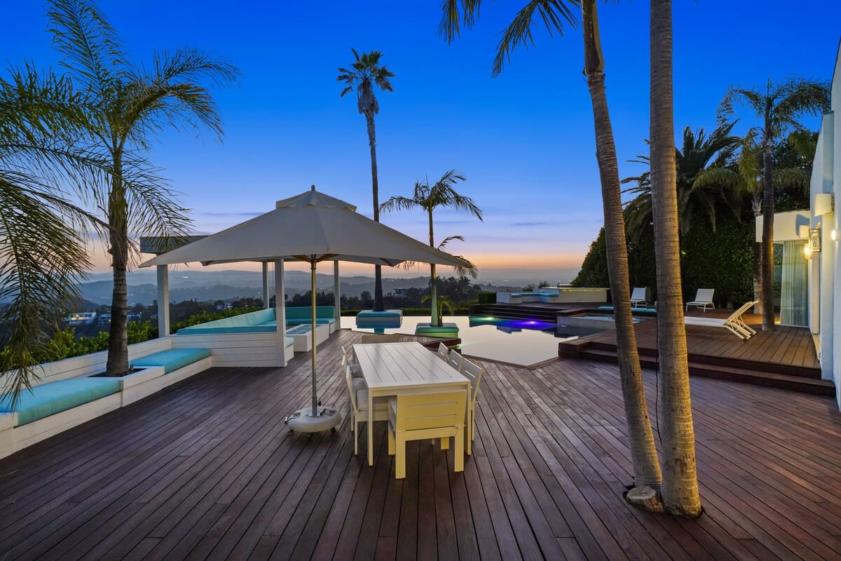 Witness the Breathtaking Sunset from the Outdoor Deck, as the sky paints a stunning canvas of colors.