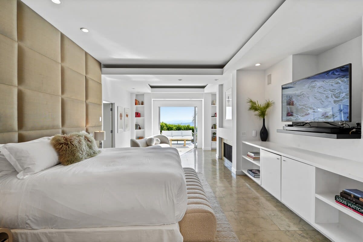 Enjoy the spaciousness of the primary bedroom, complete with a TV for entertainment.