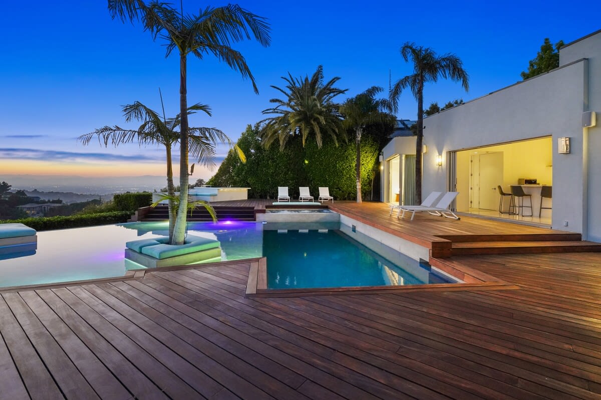 Delight in the Allure of the Pool at Night, with its shimmering waters reflecting the sunset.