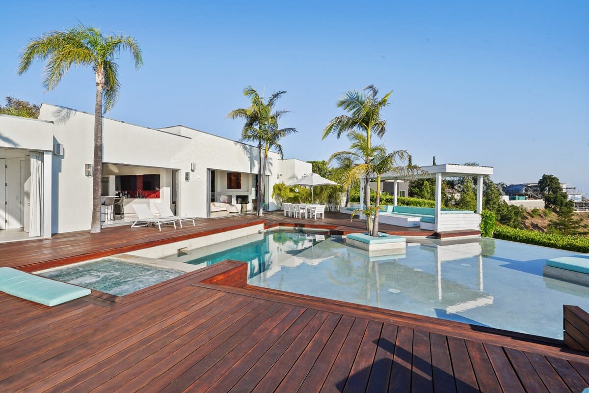 The outdoor deck offers ample space for entertaining, creating a welcoming setting for gatherings and making cherished memories.