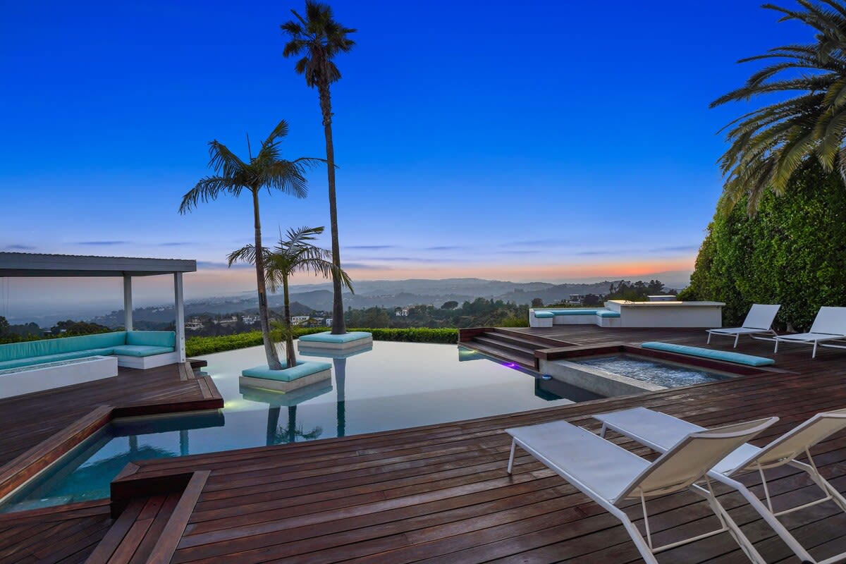 Watch the sunset from the poolside sunbeds, combining relaxation and stunning vistas for an unforgettable experience.