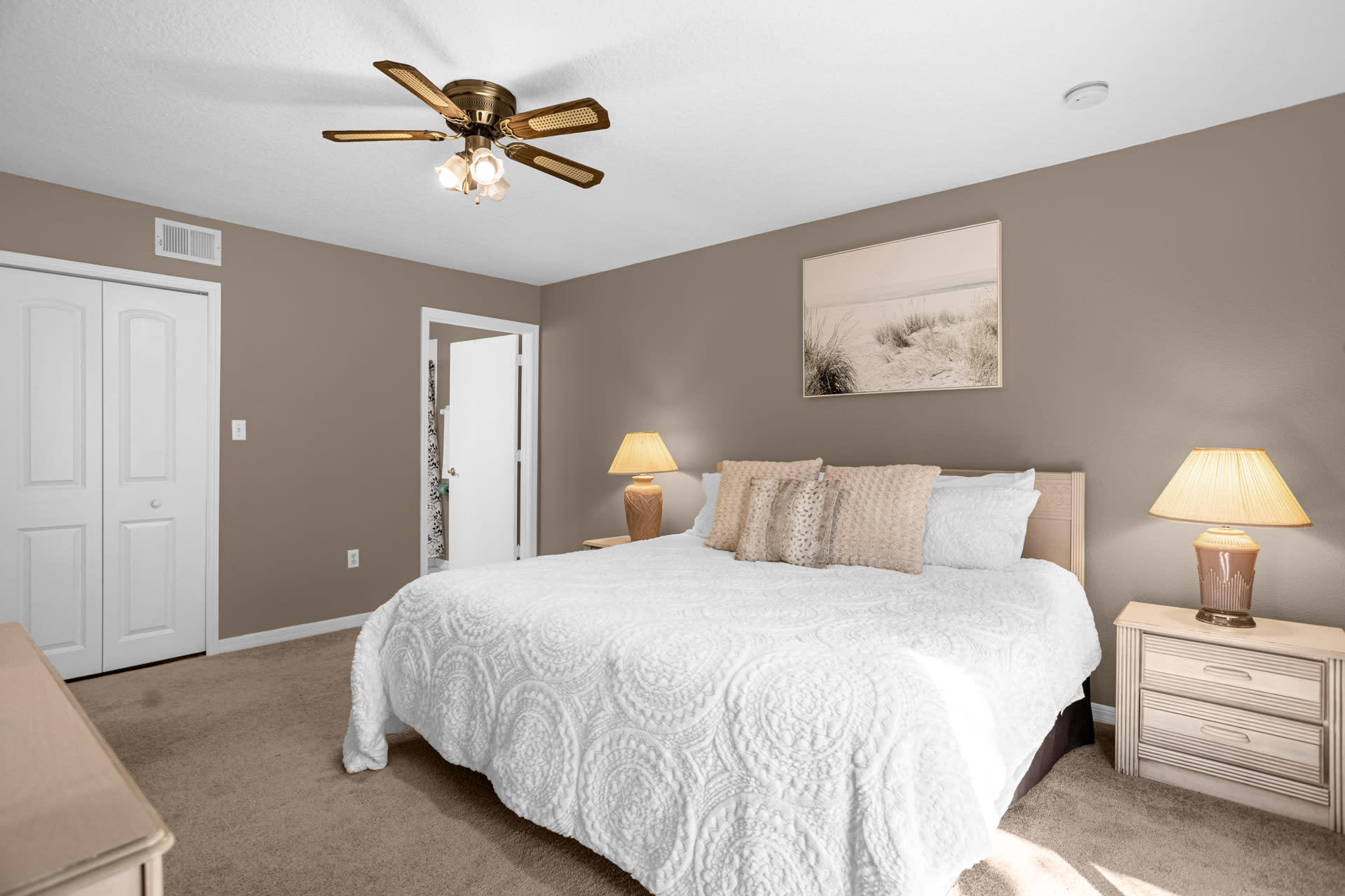 Relax In The Spacious Primary Bedroom With Stylish Decor