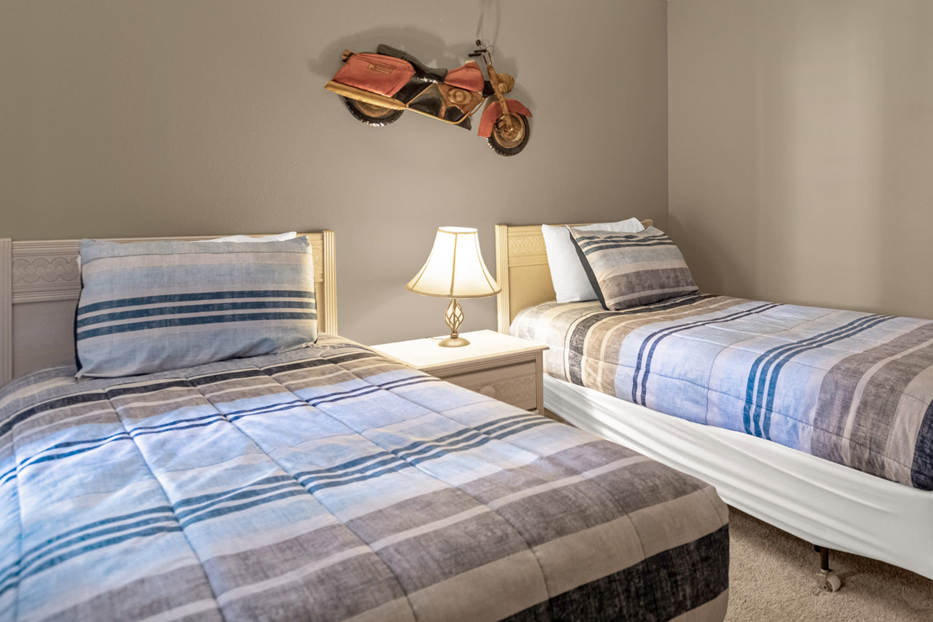 Enjoy Restful Nights In These Plush Twin Beds With Stylish Linens