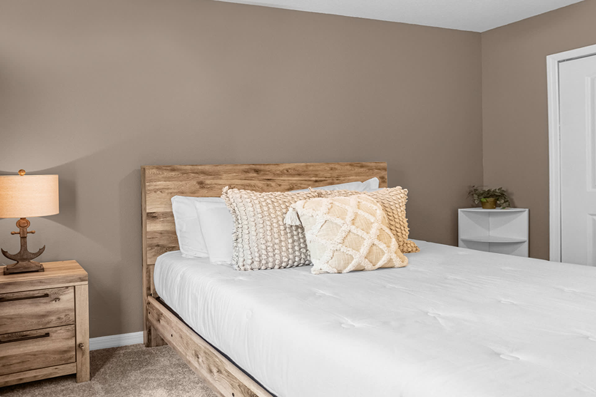Rustic Bedroom Featuring Wooden Accents And Modern Amenities