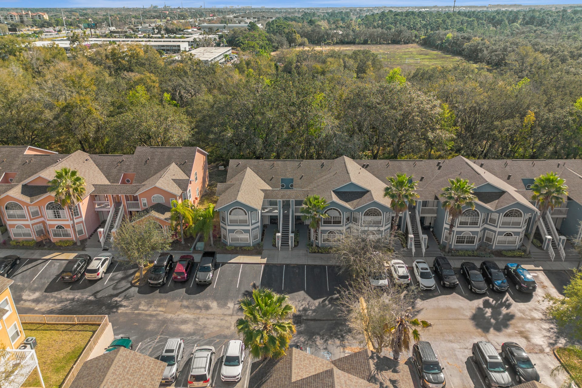 Stunning View Of The Residences With Ample Parking And Palm-Lined Streets