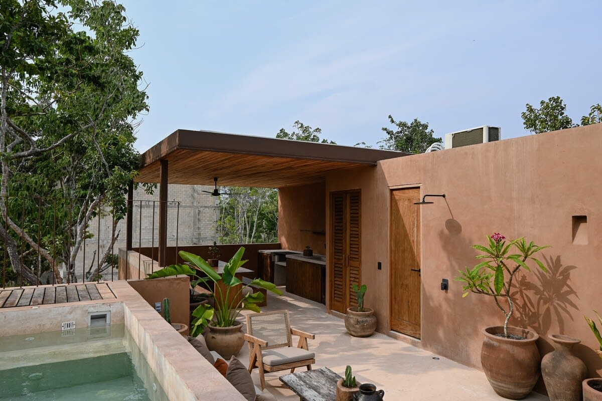 Terrace with pool and grill.