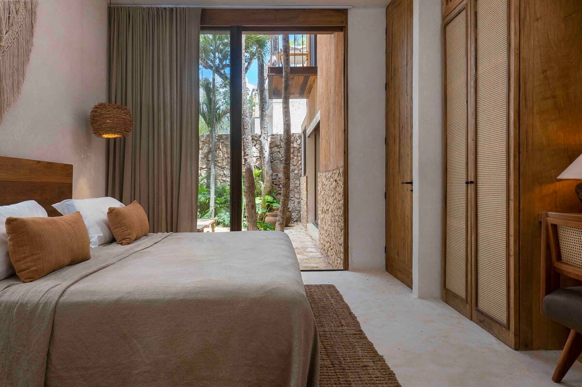 Main floor bedroom, with direct garden access, ensuite bathroom and dedicated workspace