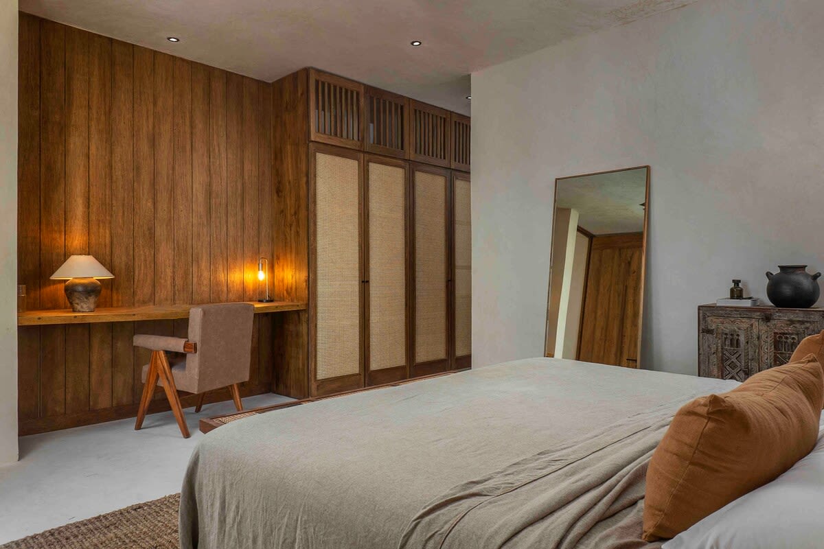 Bedroom 2, on the second floor, with king size bed, ensuite bathroom, patio access and dedicated workspace