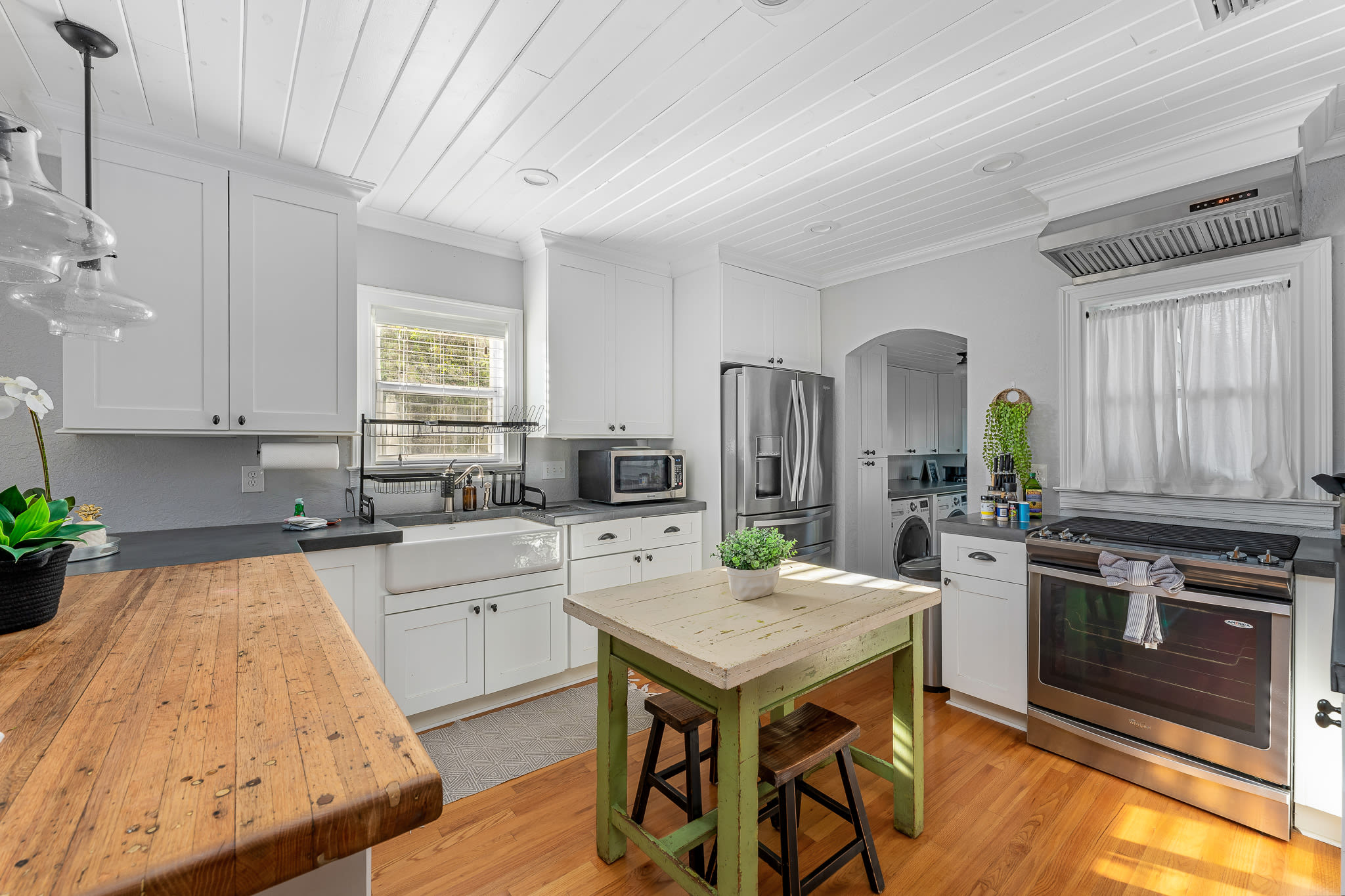 Full kitchen with stainless appliances and gas stove