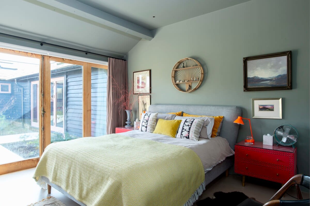 This king room has doors leading out to the garden.