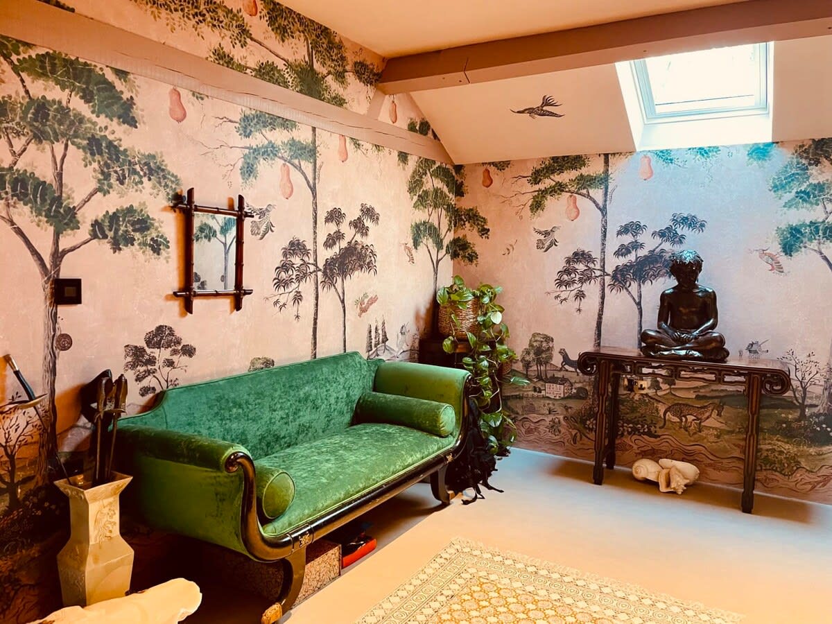 Cultural art and worldly artefacts fill the home.