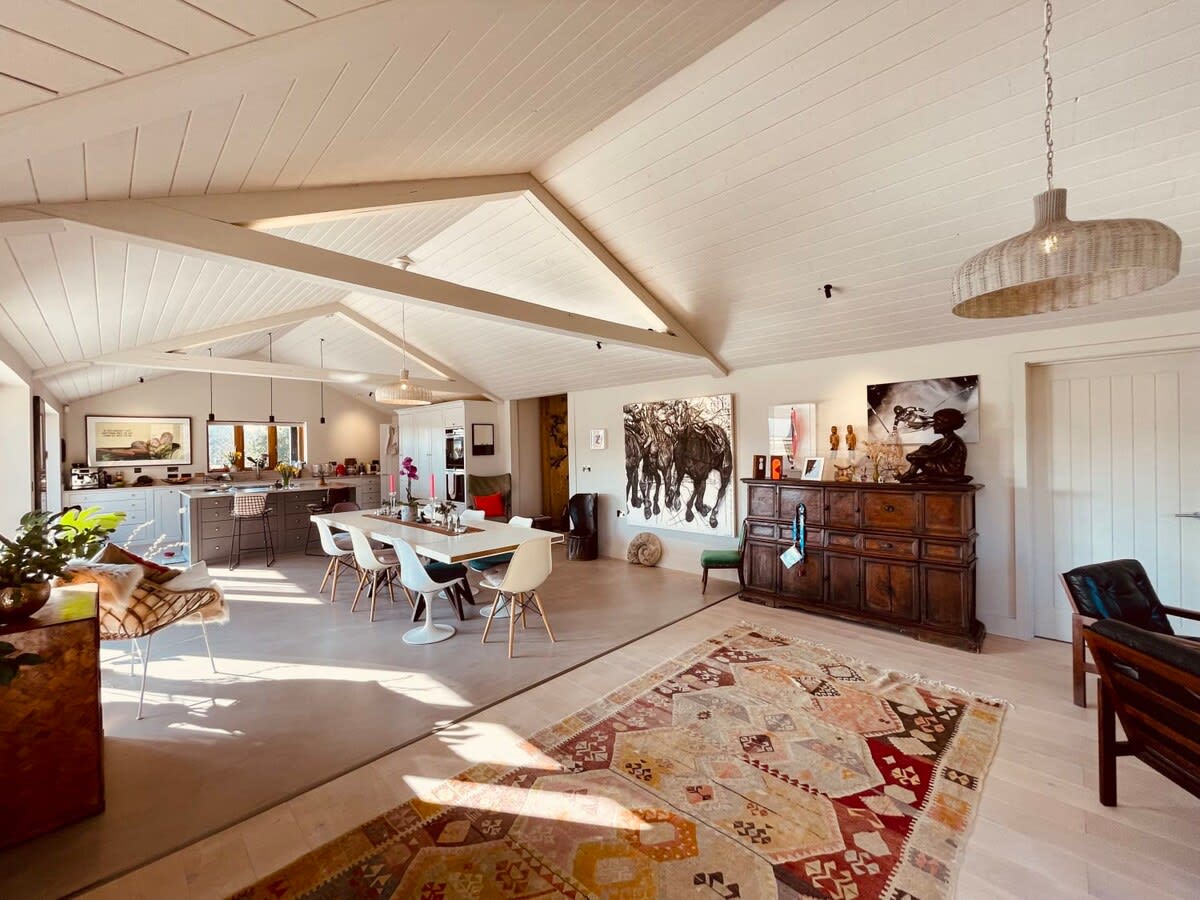 The open plan kitchen and living fuses dining, socialising and relaxing into one stunning space.