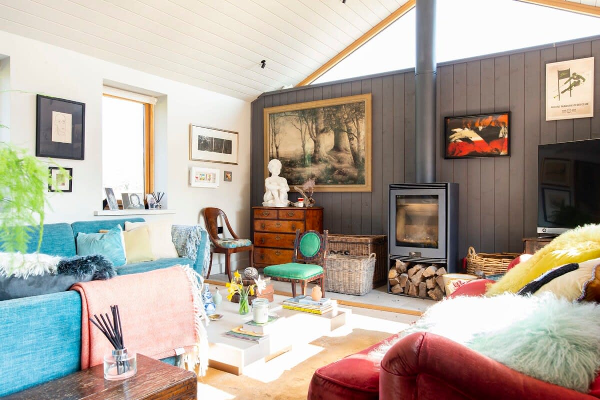The living room has cosy throws, cushions and wonderful sofas to sink into. Light the wood burner on cooler nights while you enjoy a film or favourite TV show.