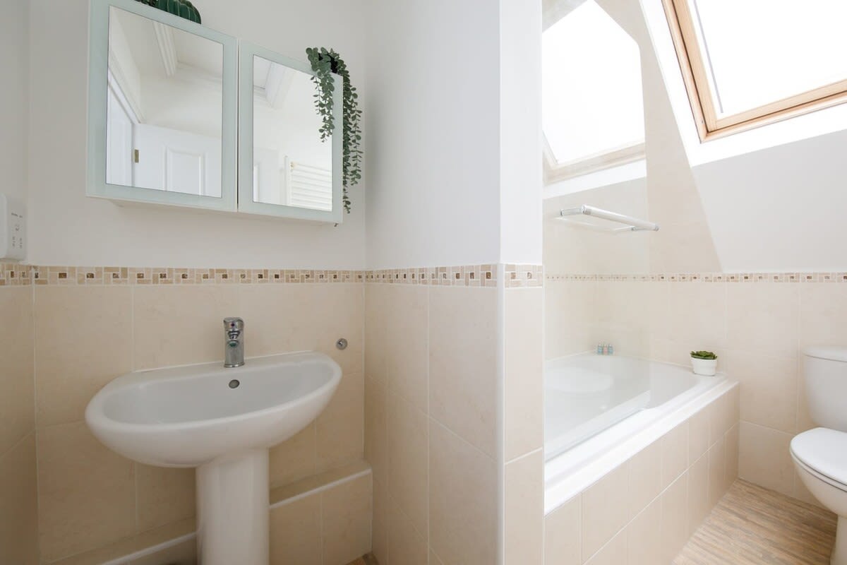 Clean and bright family bathroom