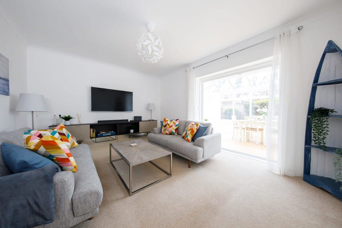 Spacious lounge leading to the conservatory dining area.