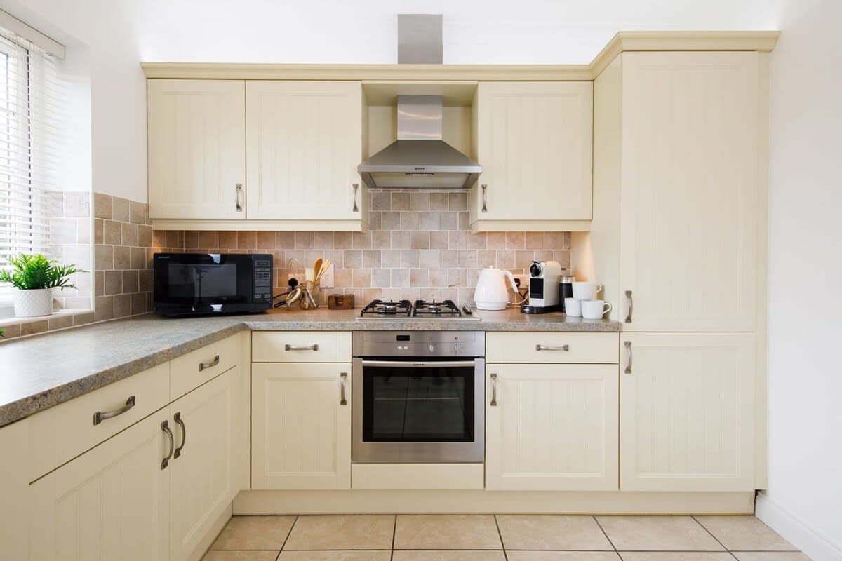 Fully equipped kitchen with fridge/freezer, gas hob, oven, microwave, kettle and coffee machine.