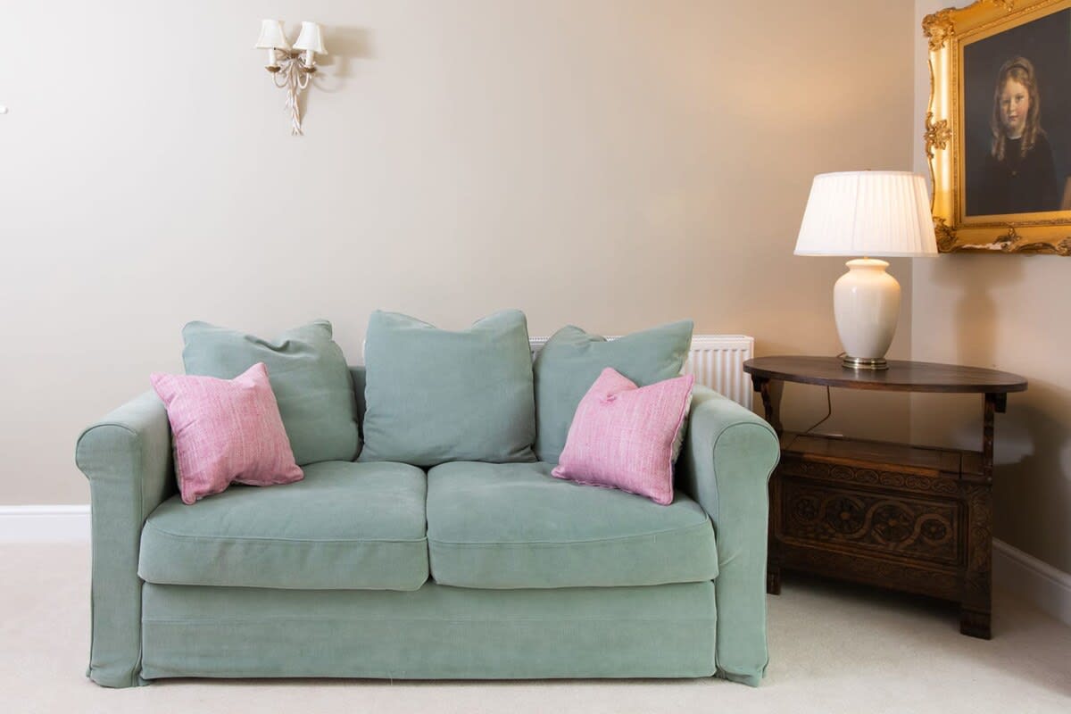Comfy sofa to unwind on with a good book and cup of tea.