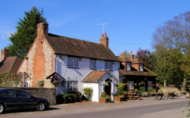 The George Country pub in Eartha, with 3 open fires, rustic wooden tables and a beer garden plus seasonal British cuisine.