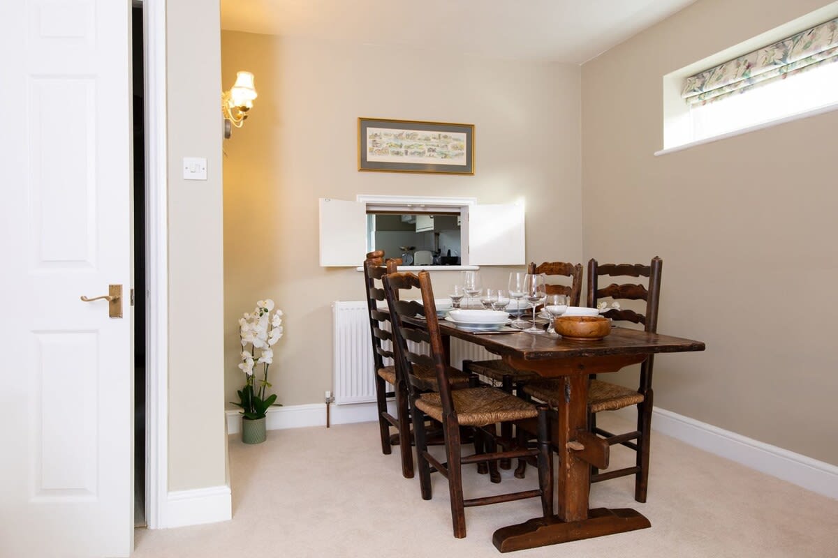 The wooden dining table comfortably seats 4.