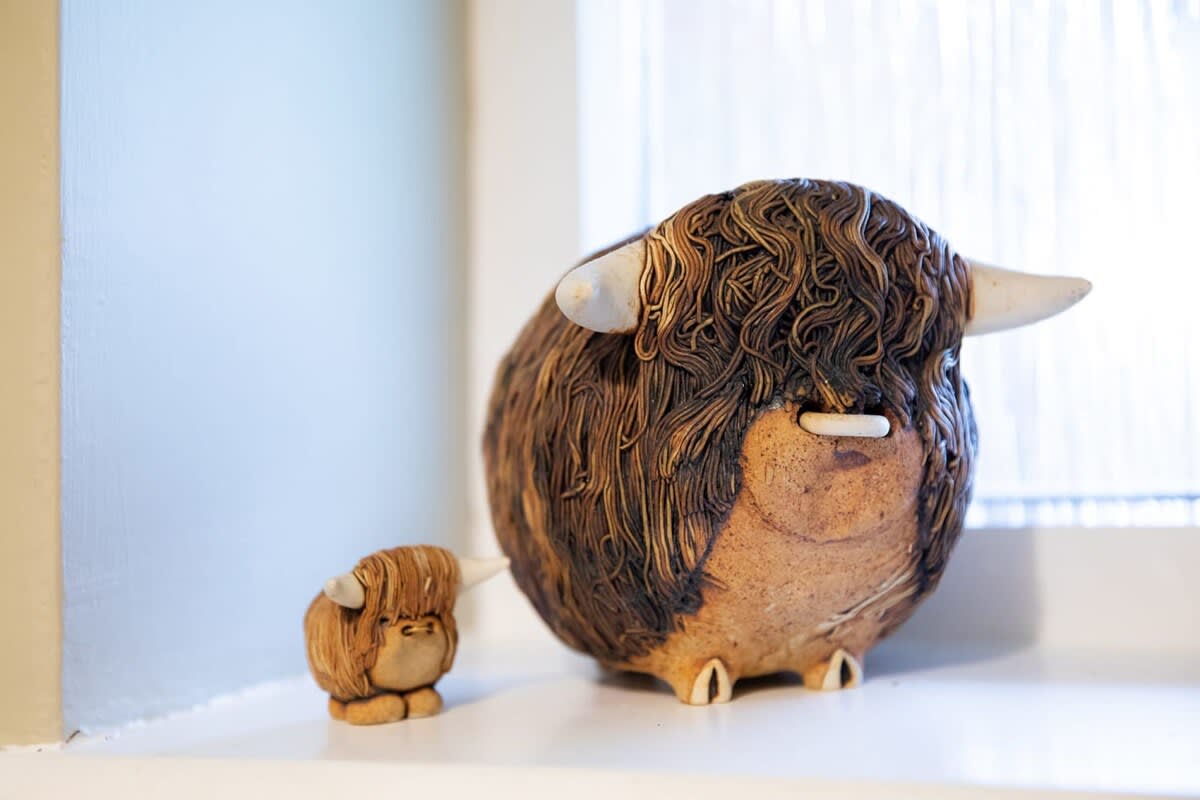 Cute figures are dotted around the cottage.