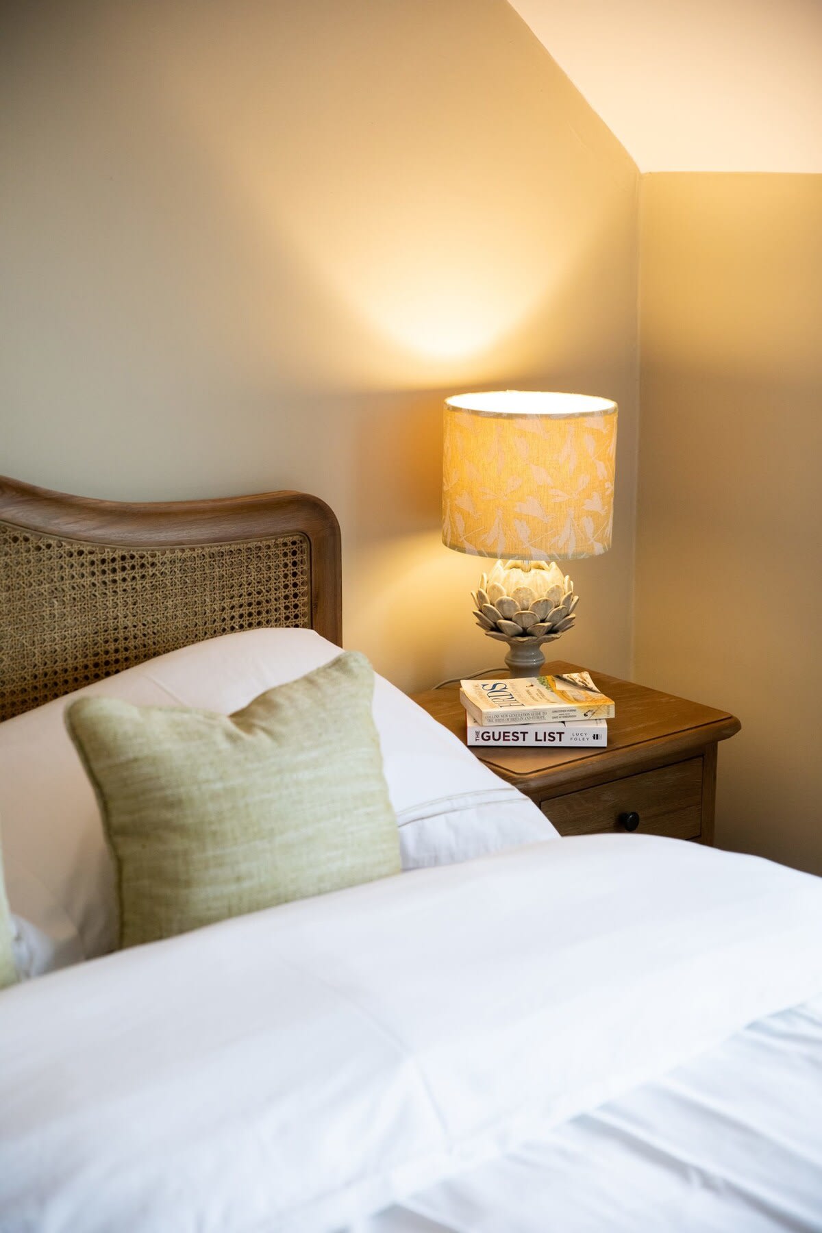 The rooms have bedside tables and reading lamps.