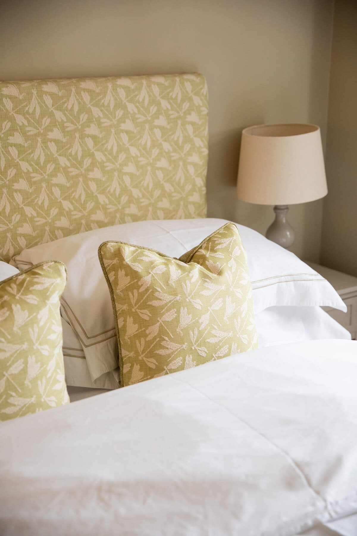The bedrooms are adorned with pretty cushions.