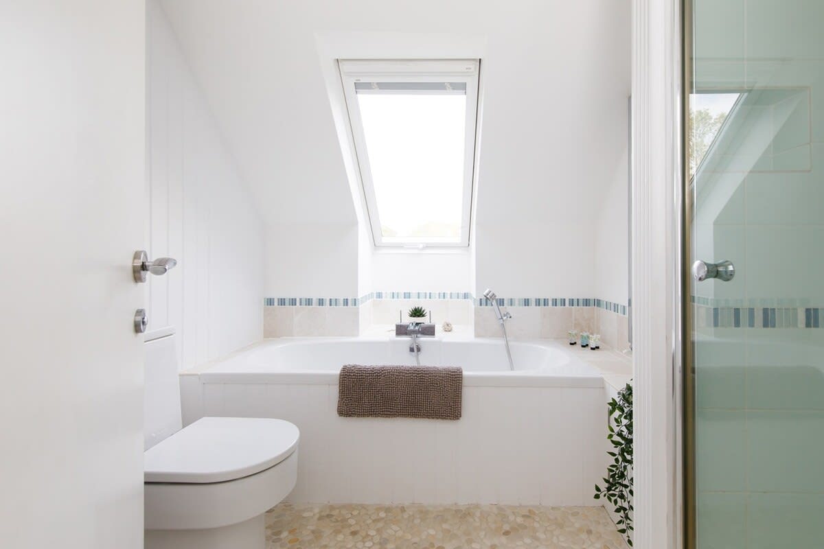 The family bathroom has a large bath, separate shower, WC and basin.