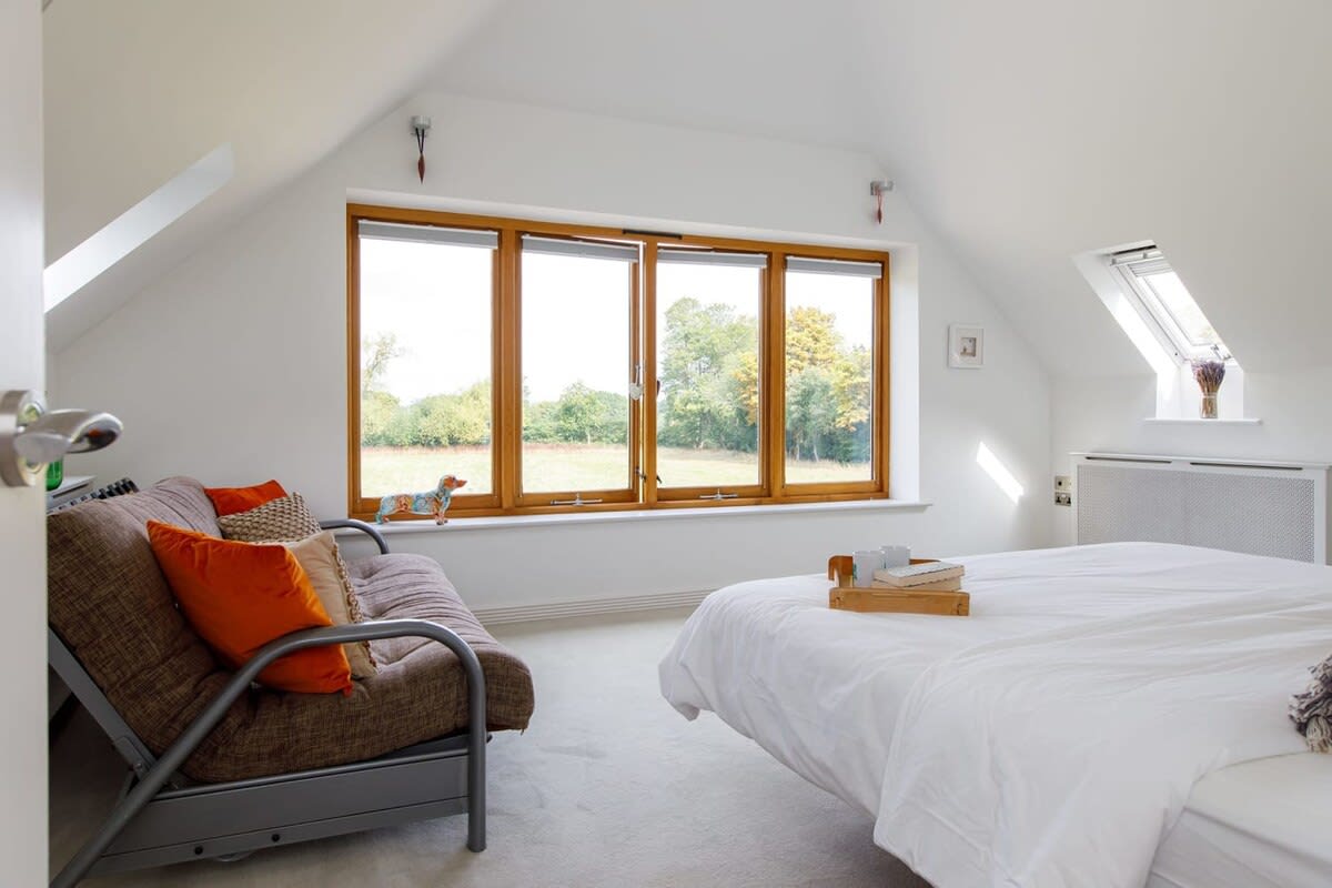 The large central window is a main focus of the room offering amazing views across the garden and allowing plenty of light in.