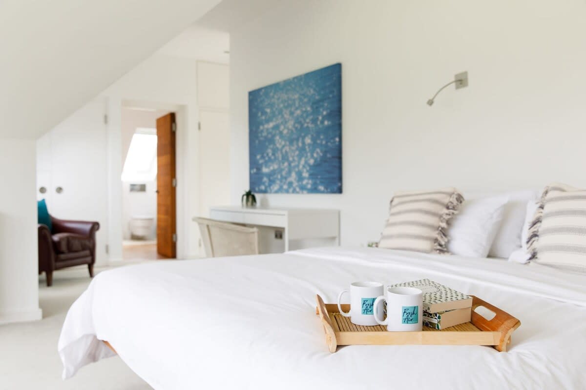 After a good night's sleep, enjoy a cup of tea in bed as you gaze out to towering trees and lawns.